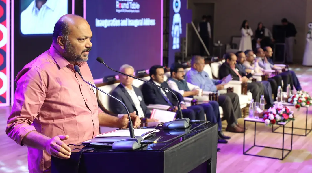 Minister P. Rajeev addressing the Robotics Roundtable in Kochi, discussing the growth of the robotics sector in Kerala as a major job creator.